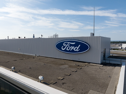 The Ford Motor Company atop of their Canada headquarters office building at their Oakville Assembly plant is seen closeup on a sunny day.