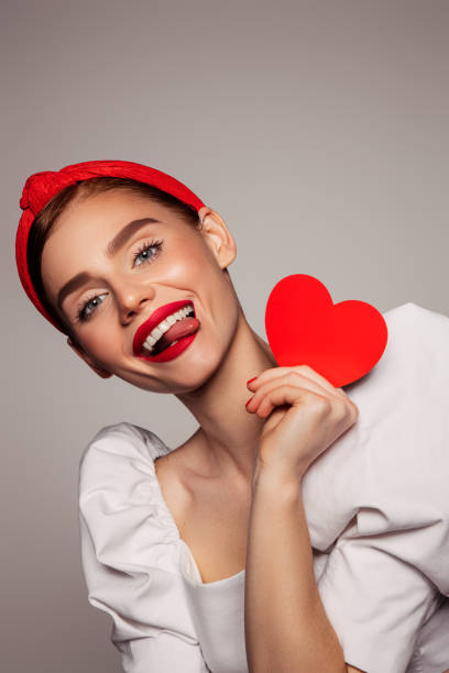 istock Beautiful emotional woman holding present box 1409634192