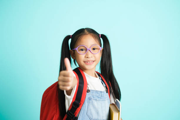 istock Kid students girl going to school, i like school. 1409634286