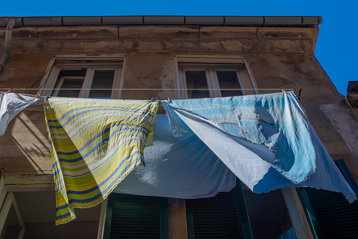 laundry drying on the street in Italy