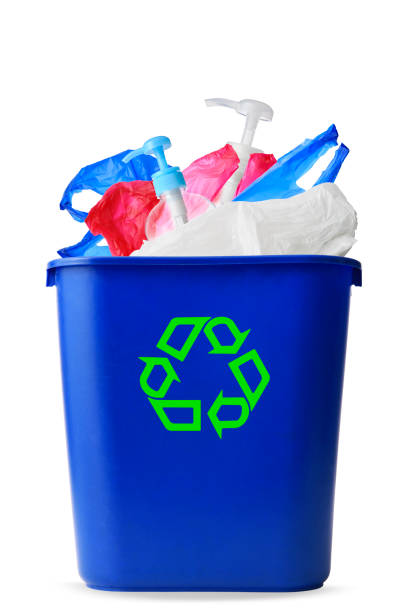 istock Isolated shot of plastic garbages within blue plastic recycle bin on white background 1409636859