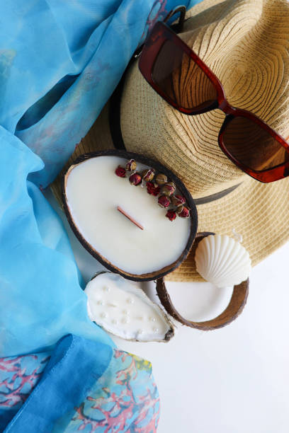 istock romantic composition of straw hat, palm leaf and sea shells on white background 1409636872