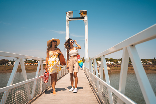 Tourists, Barril Beach, Bridge, Tavira, Portugal