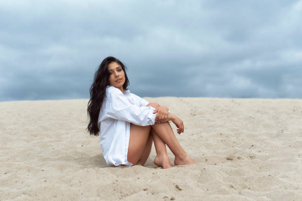 istock Young Woman on Sand Dunes 1409642436