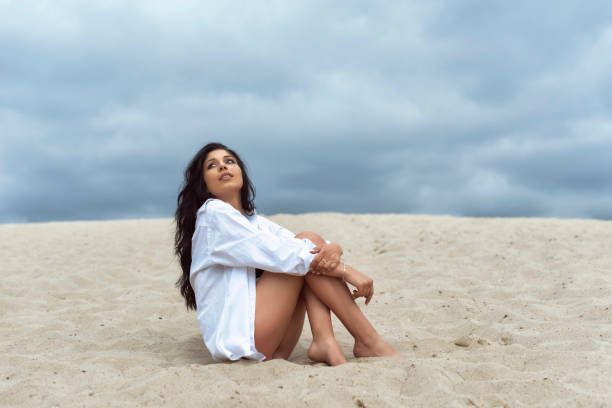 istock Young Woman on Sand Dunes 1409642450