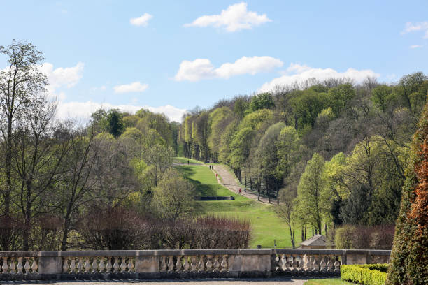 people walking on pathway on the hill of saint-cloud park in Paris