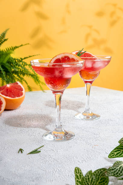 istock Summer refreshing sparcling cocktails with grapefruit. Lemonade garnished with fresh rosemary. Summer beverage with sparkling water and grapefruit slices. 1409645243