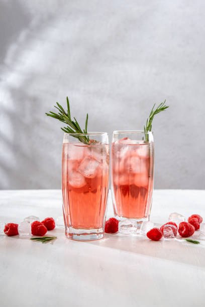 istock Summer refreshing non-alcoholic cocktails. Raspberry lemonade garnished with fresh rosemary. Summer raspberry beverage with sparkling water. Copy space. 1409645469