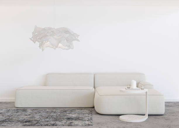 istock Empty white wall in modern living room. Mock up interior in contemporary style. Free, copy space for your picture, text, or another design. Sofa, carpet, table, lamp. 3D rendering. 1409647399