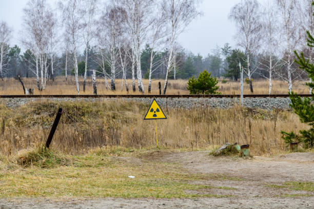 Radiation sign near the railroad at Chernobyl exclusion zone, Ukraine stock photo