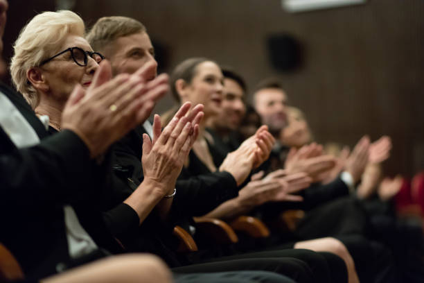 istock Spectators clapping in the theater 1409650520