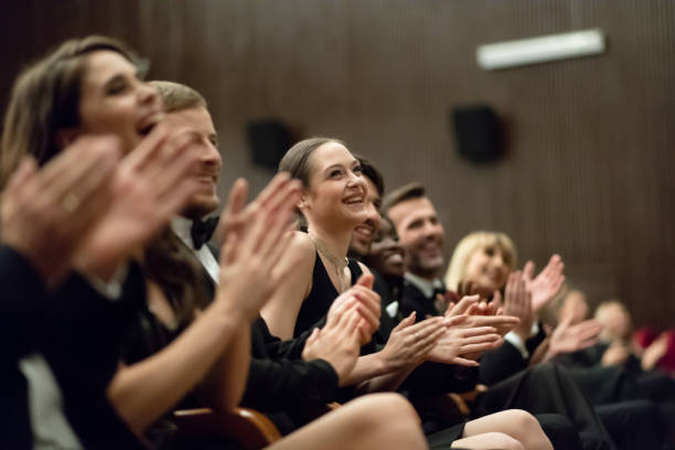 istock Spectators clapping in the theater 1409650748