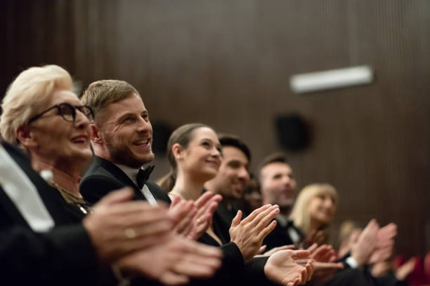 istock Spectators clapping in the theater, close up of hands 1409650856