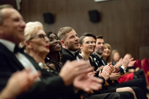 Spectators clapping in the theater, close up of hands stock photo