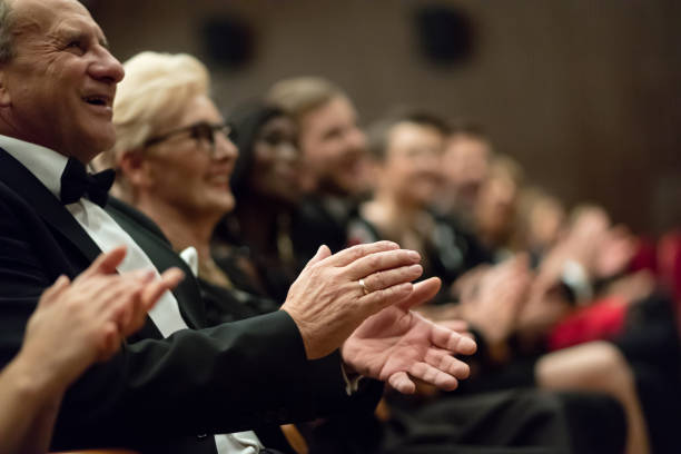 istock Spectators clapping in the theater, focus on hands 1409652039