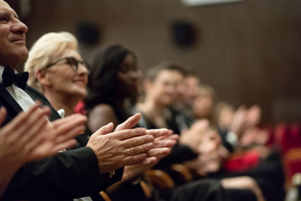 istock Spectators clapping in the theater, focus on hands 1409652293