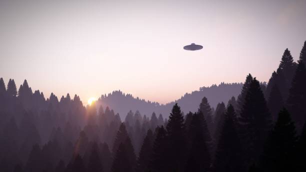 istock 3D illustration. UFO over the mountains 1409652620