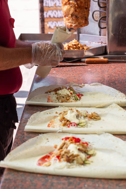 istock Hands of a professional chef who makes Shawarma 1409652648