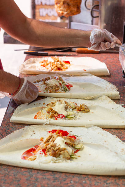 istock Hands of a professional chef who makes Shawarma 1409652695