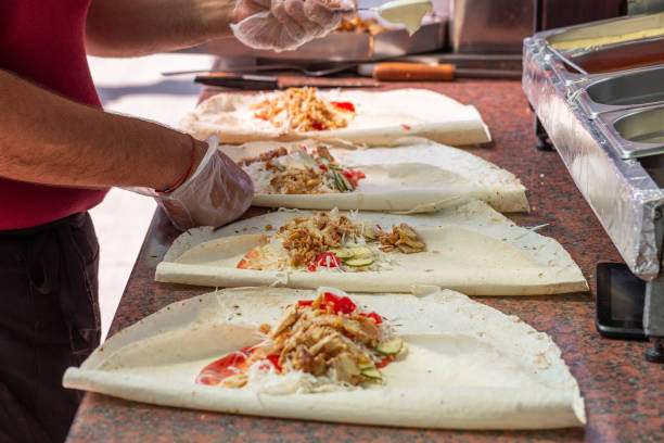 istock Hands of a professional chef who makes Shawarma 1409652706
