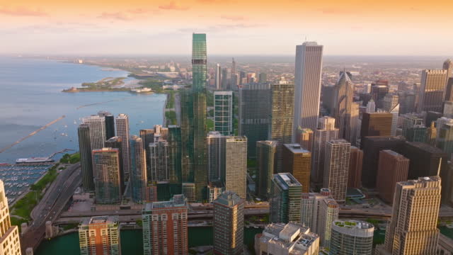 Stunning skyscrapers of contemporary Chicago towering over majestic lake. Beautiful cityscape with endless horizon.