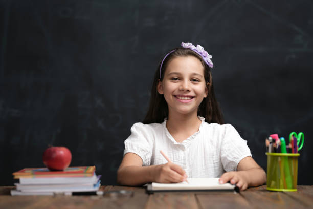 istock Back To School Concept, Happy Smiling Child Student Studying 1409654464