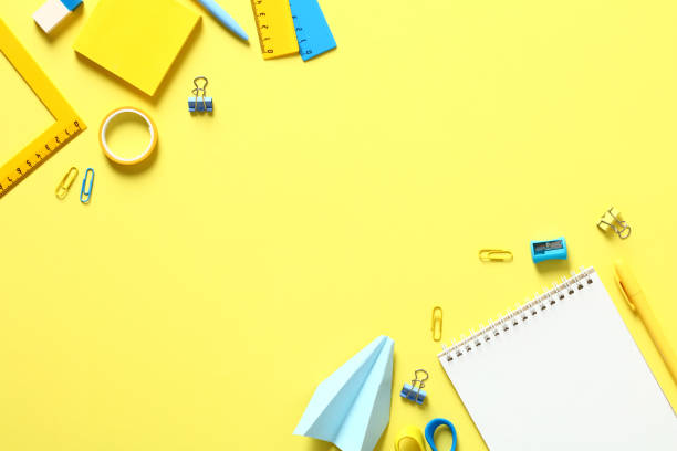 istock Back to school concept. Flat lay composition with school supplies on yellow background. Top view. Minimal style. 1409655809