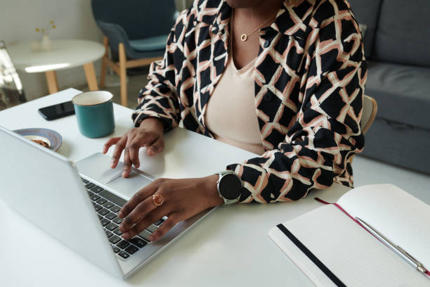 istock Woman typing on laptop at table 1409656700