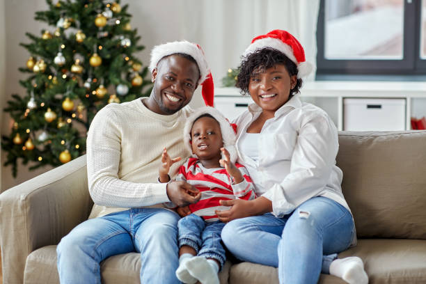 african american family at home on christmas stock photo