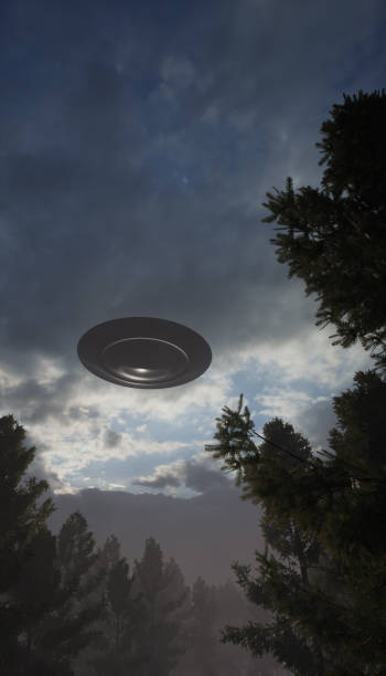 istock 3d illustration. UFO in the sky over the old forest road. 1409657441