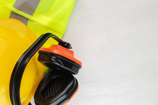 istock safety work protective accessories, worker's uniform, engineer's helmet, earmuffs, reflective vest on a white background, copy space 1409657449