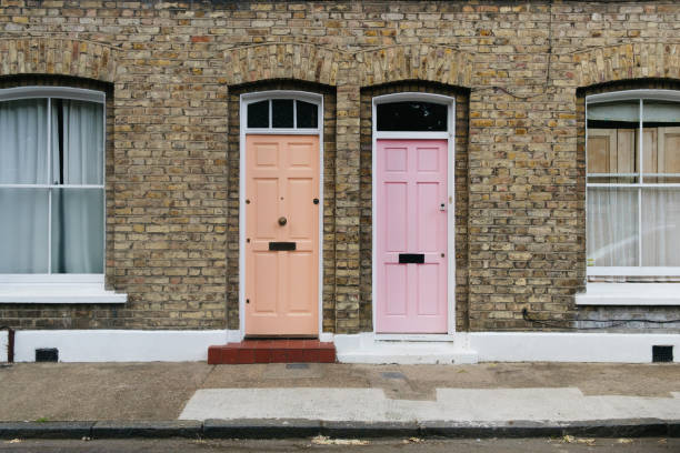 istock Two identical pink doors in London, England. 1409657458