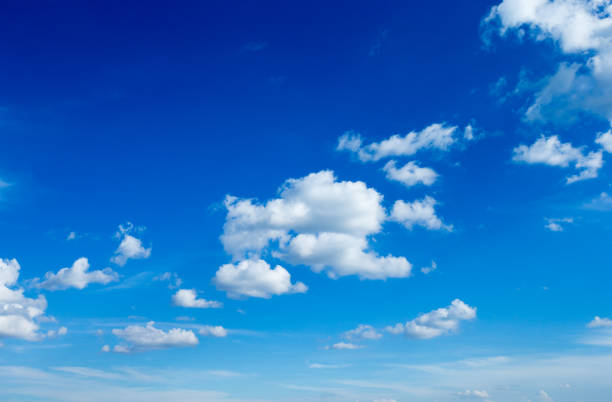 Blue sky background with tiny clouds. fluffy clouds in the sky. Background summer sky stock photo