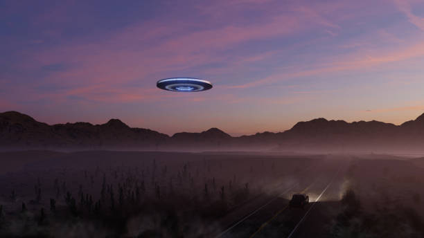 istock 3d render. UFO over the road in the desert at sunset. 1409658201