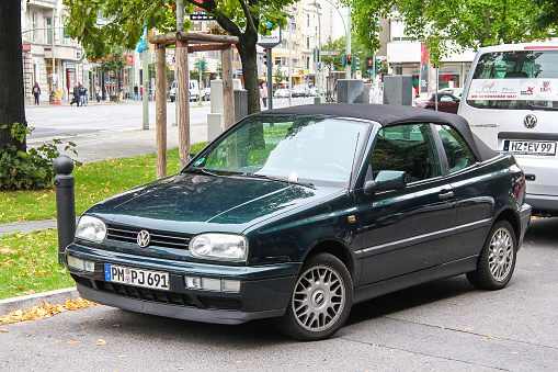 Berlin, Germany - September 10, 2013: Compact convertible car Volkswagen Golf in the city street.