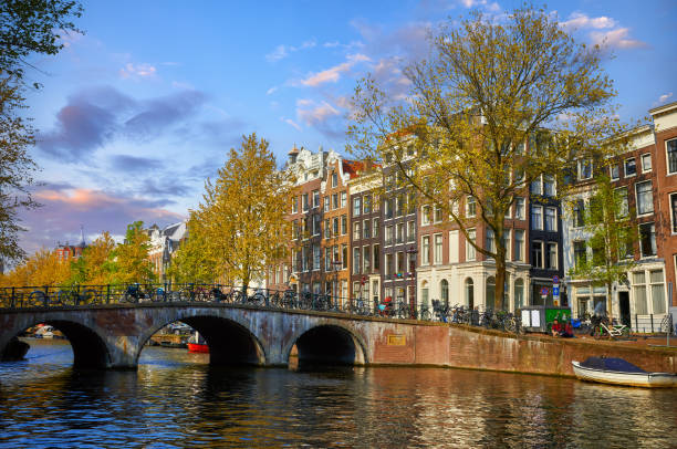 Bridge over channel in Amsterdam Netherlands houses river Amstel​​​ foto