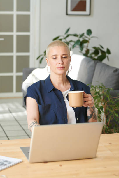 istock Woman talking online on laptop 1409664547