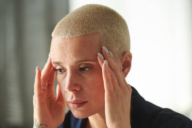 istock Stressed woman having a headache 1409664887