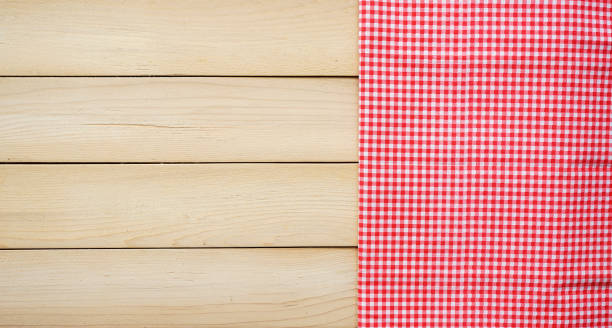 istock Classic pink tablecloth on wood plank with copy space 1409665970
