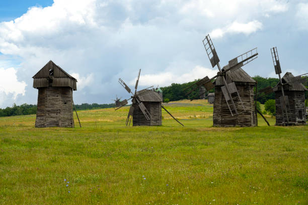istock Ancient mills. Field with windmills on a summer day 1409666510