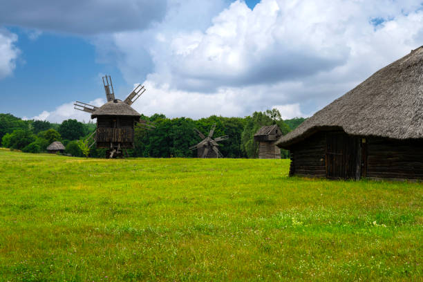 istock Ancient mills. Field with windmills on a summer day 1409666548