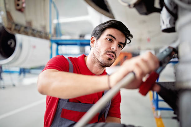 istock Aircraft mechanic is working in an airplane hangar 1409671301