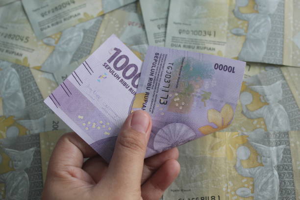 istock several ten thousand and two thousand rupiah bills 1409673418