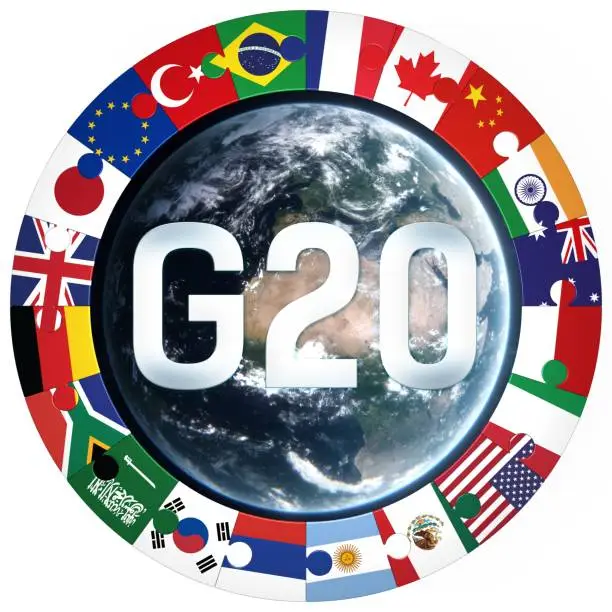 "G20" -Group of Twenty text with member nation flags and globe icon. Isolated 3d Illustration logo of country puzzle piece ring around the world. Symbol of togetherness and international collaboration. Globe texture elements created with Autodesk Flame, Adobe Illustrator and Photoshop based on reference of free NASA space imagery (https://svs.gsfc.nasa.gov) in artistic, not scientific accuracy.