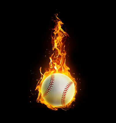 Baseball, on fire on black background