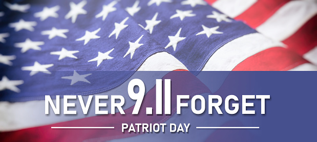 9 11 USA Never Forget. White text on United States America flag background. Patriot Day. Remember September 11, 2001.