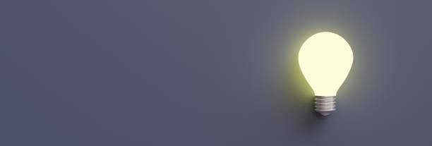istock Idea light bulb concept. Glow old glass screw lamp on gray, front view, copy space, 3d render 1409679509