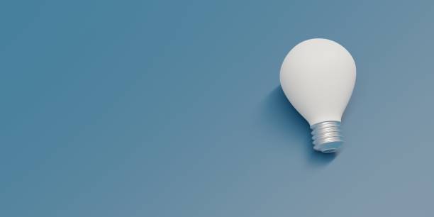 istock Light bulb white on blue background, above view. Old glass screw lamp, copy space. 3d render 1409679510