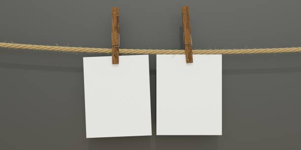 istock Paper card hang with clothespin. Blank memo note, reminder on black. Advertise template. 3d render 1409679541