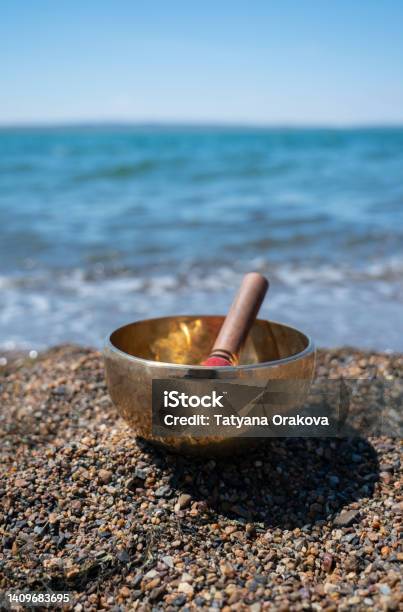 Singing Bowl On The Shore Of The Lake Stock Photo - Download Image Now - Rin Gong, Tibet, Mindfulness